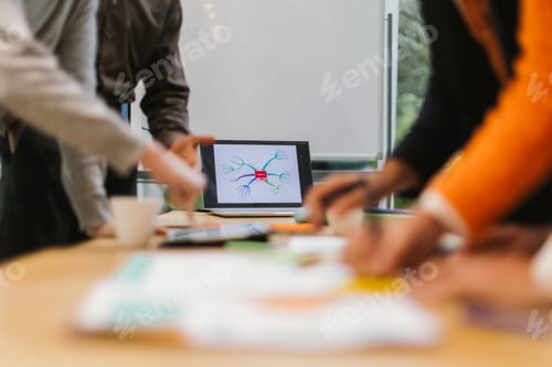 Preview: Businesspeople analyzing mind map on laptop during brainstorming session