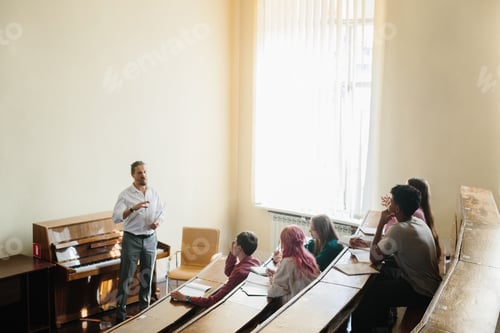 Preview: University Professor Lecturing Engaged Students in a Bright Classroom