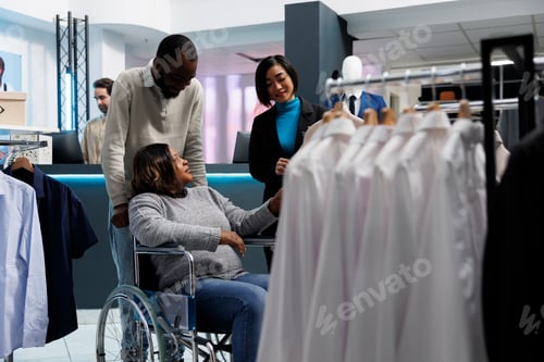 Preview: Woman in wheelchair in clothing store