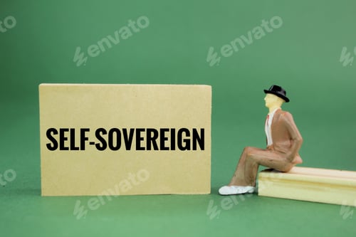 Preview: miniature people and paper with the word SELF-SOVEREIGN