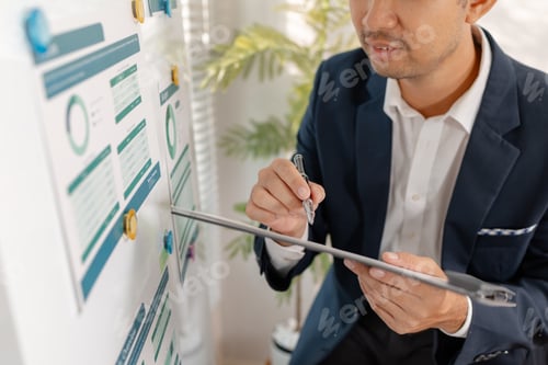Preview: A professional businessman presenting financial analysis on charts