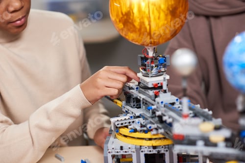 Preview: Student working with robot for science project