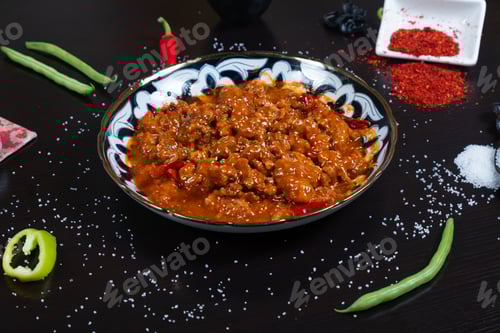 Preview: Asian food. Beef in spicy sauce with sesame seeds and chili pepper