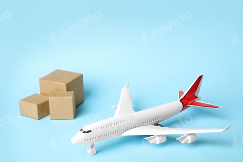 Preview: Toy plane on blue background. Logistics and wholesale concept