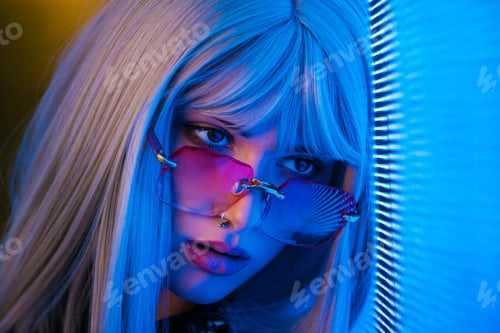 Preview: Beautiful woman illuminated by led lights