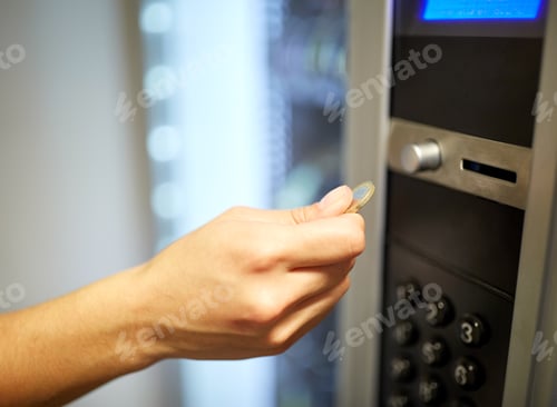 Preview: hand inserting euro coin to vending machine