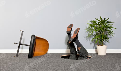 Preview: Businessman disappearing through hole in the floor