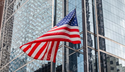 Preview: American flag in Chicago, Illinois downtown. Glass facade buildings background.