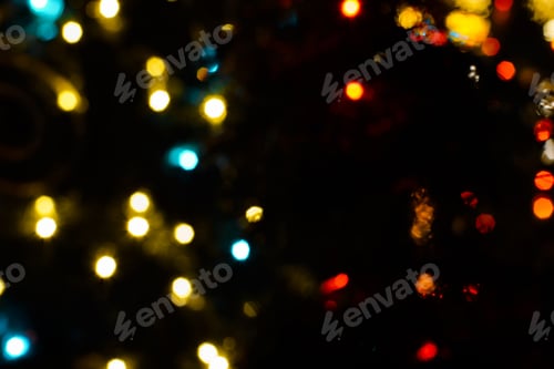 Preview: Multicolored Christmas street lights in blur. Festive background. Soft focus