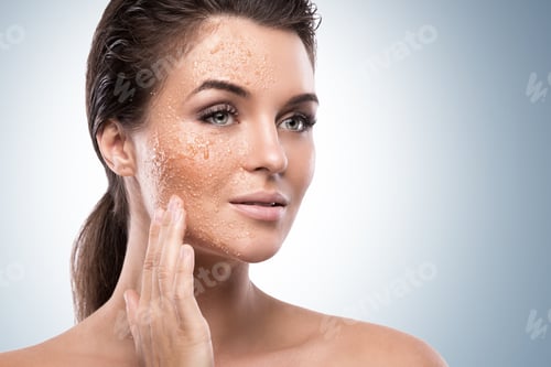 Preview: Woman Applying Facial Scrub with Hydrating Skin Effect