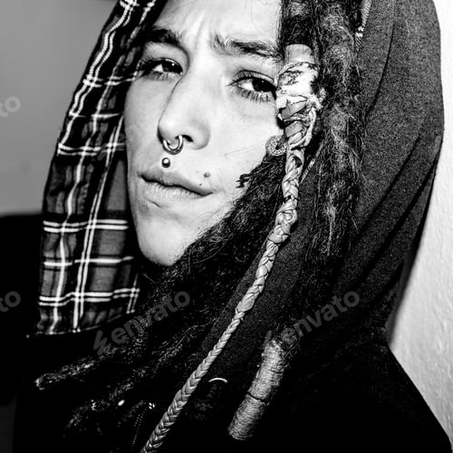 Preview: Portrait of Latin girl with dreadlocks and piercing. Street styl