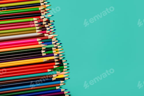 Preview: Back to school. Colorful multicolor pencils on blue background. Flatly
