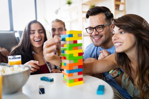 Preview: Happy group of friends have fun and playing board game together