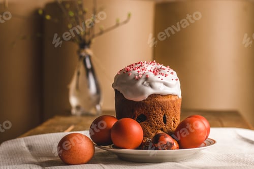 Preview: Homemade Easter cake and painted eggs. A simple festive composition for the Easter holiday.
