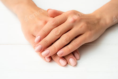 Preview: Woman's hands on a white table