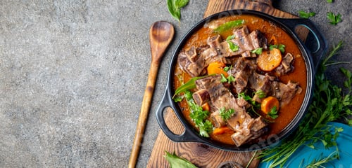 Preview: Beef ribs Bourguignon. Beef ribs stewed with carrot, onion in red wine. France dish. Top view