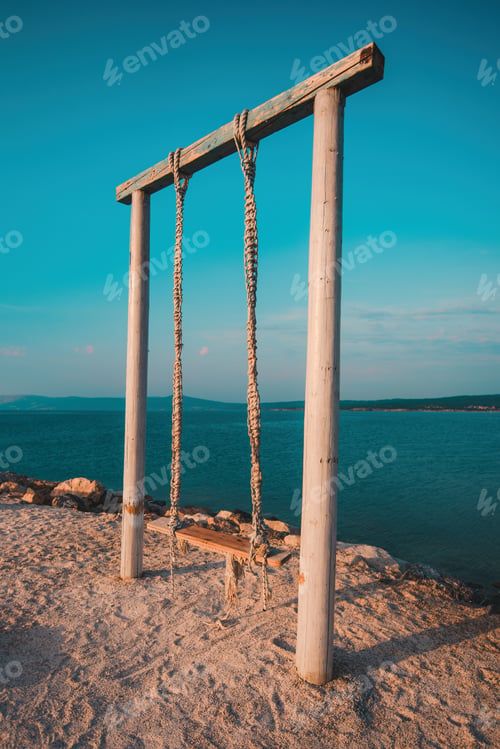 Preview: Beach swing at seaside coast in summer morning