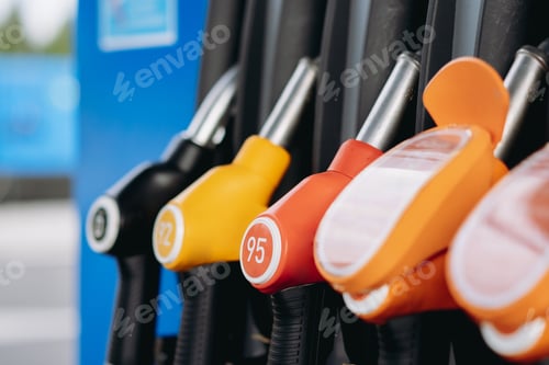 Preview: petrol pump filling fuel nozzles at gas station