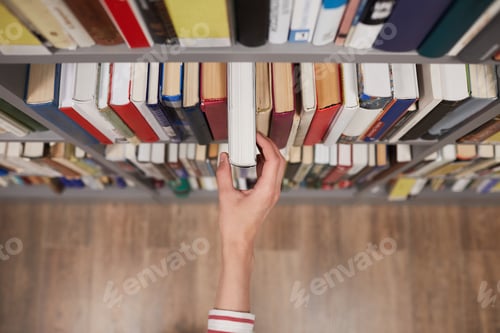 Preview: Student taking Book in Library