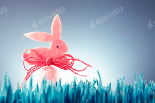 Preview: Easter background concept with pink bunny figure