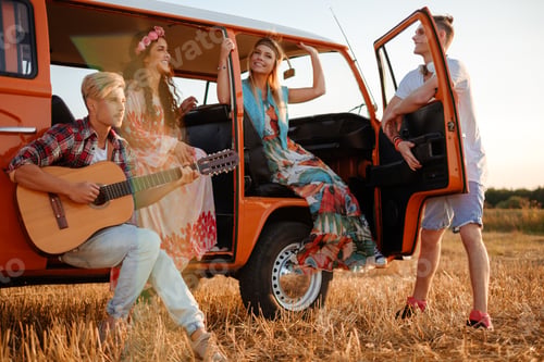 Preview: Hippie friends with guitar on a road trip