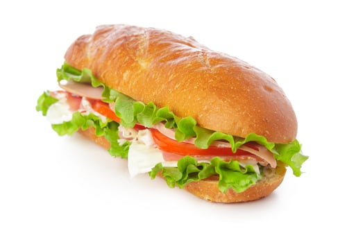 Preview: Sandwich with lettuce, tomato, and ham on a white background ready to eat