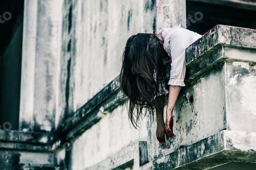 Preview: Horror Scene of a Woman with Bloody body.Zombie woman sitting hanging legs on building is screaming
