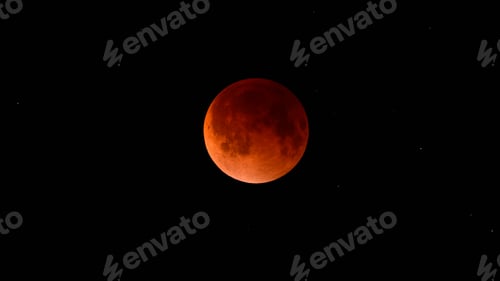 Preview: Blood moon during a lunar eclipse in the night sky. The moon appears red, shadowed by the Earth