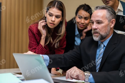 Preview: Group of multi-Ethnic businessman and businesswoman working in office.