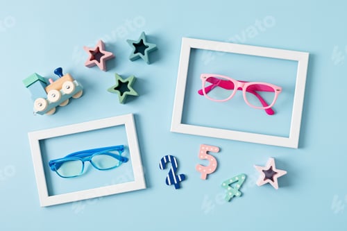 Preview: Child eyeglasses over pastel background. Optical store, glasses selection for kids