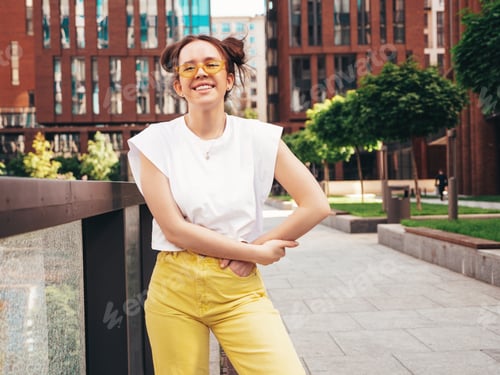 Preview: Young beautiful hipster girl posing outdoors