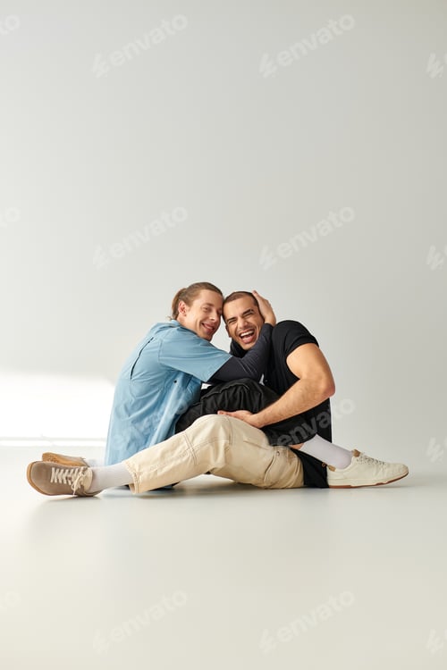 Preview: Ethereal Love: Two Men Sitting Atop White Floor