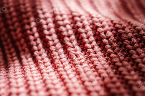 Preview: Knitted texture of a pink sweater or scarf close-up.