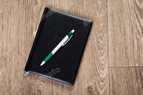 Preview: Blank note paper with pen on wood background