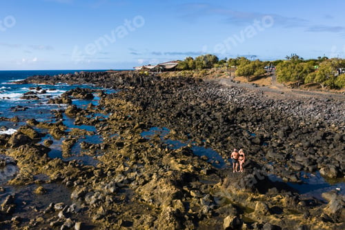 Preview: The couple stands on Rough rock formations near the ocean on the island of Tenerife.The Canary