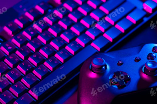 Preview: Computer keyboard and joystick on black background close up