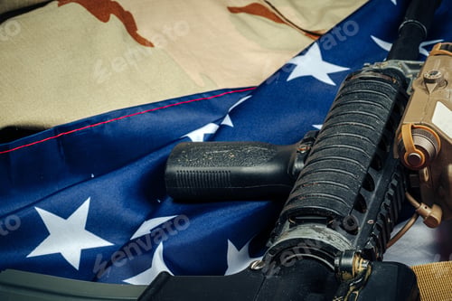 Preview: U.S. battle flag and assault rifle on the wooden table
