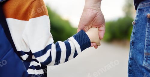 Preview: Little boy with his father going to school after summer break. Photo of child and parent hands