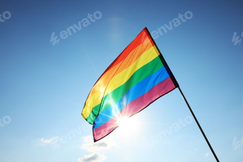 Preview: Bright LGBT flag fluttering against blue sky, space for text. Lesbian concept