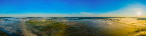 Preview: Aerial view of a beautiful summer landscape with a fog while dawn. a foggy landscape in spring.