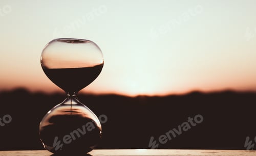Preview: Hourglass against the sunset sky