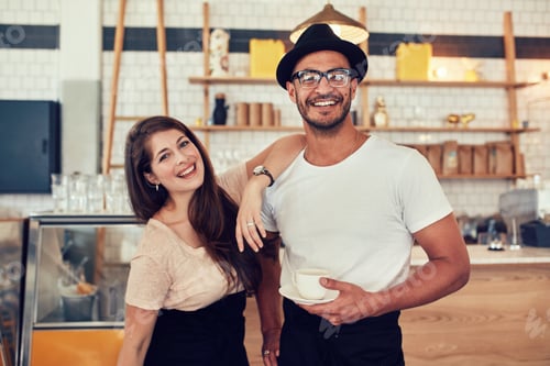 Preview: Young man and woman at cafe with a cup of coffee