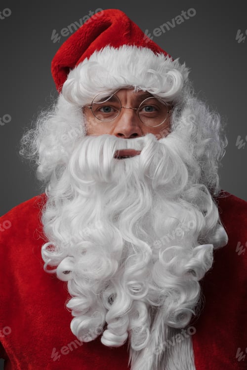 Preview: Santa dressed in red costume and hat against grey background