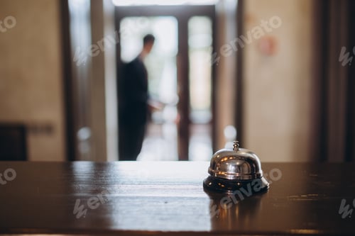 Preview: Arrival at the hotel. Reception desk with a bell in the hotel lobby.