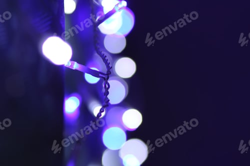 Preview: Abstract bokeh background. Blurred garland lights.