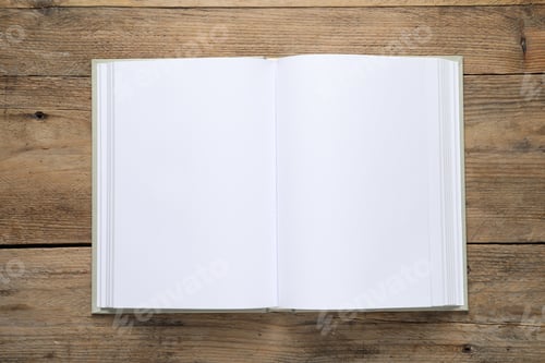 Preview: Open book on wooden table, top view