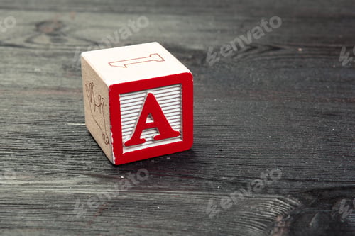 Preview: Toy cubes with letters on wooden background, copy space