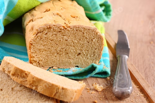 Preview: Fresh from the oven gluten free bread on a cutting board