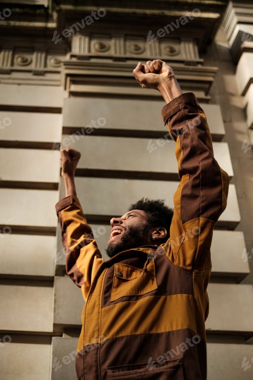Preview: Young activist raising fists in protest, fighting for rights and equality