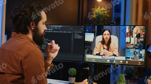 Preview: IT professional at home in remote teleconference meeting with coworkers